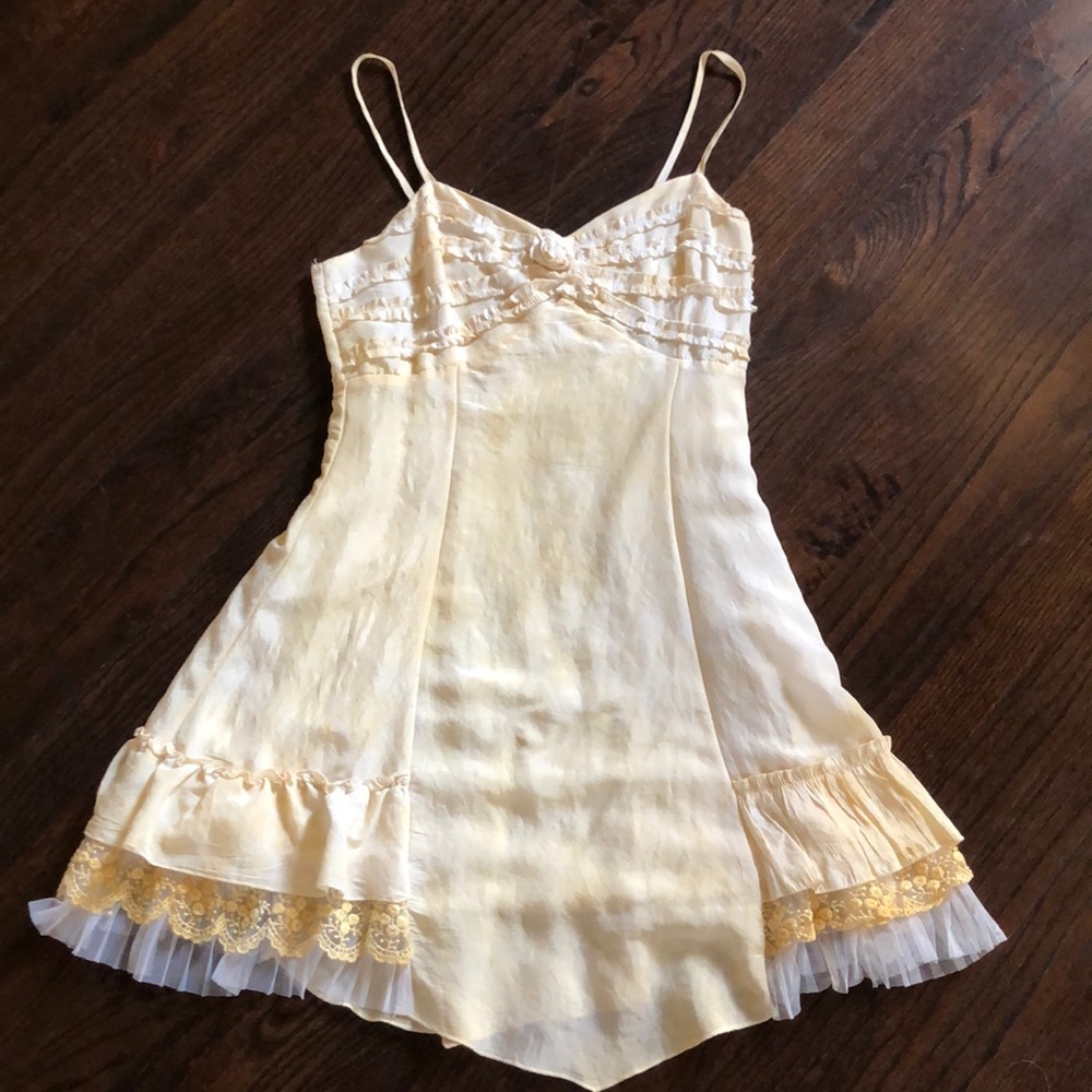A vintage spaghetti strap cream dress